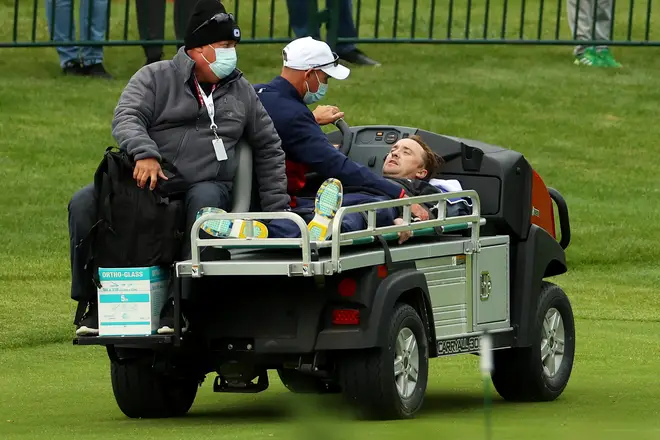 Tom Felton is carted off the course after collapsing during the celebrity matches ahead of the 43rd Ryder Cup