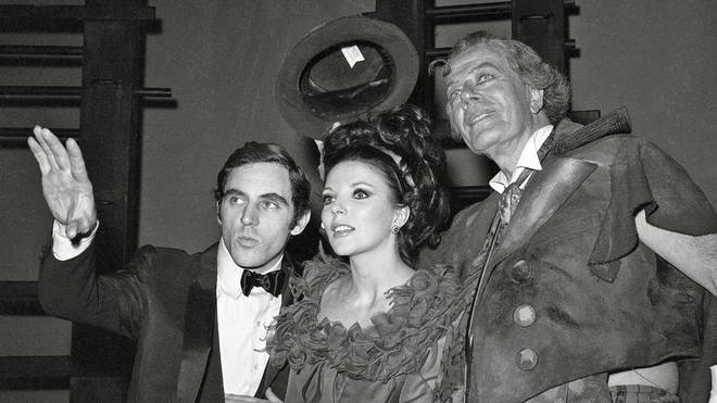 Anthony Newley, his then-wife Joan Collins and Cyril Ritchard as "Sir" in the Broadway premiere of The Roar Of The Greasepaint - The Smell Of The Crowd in May 1965.