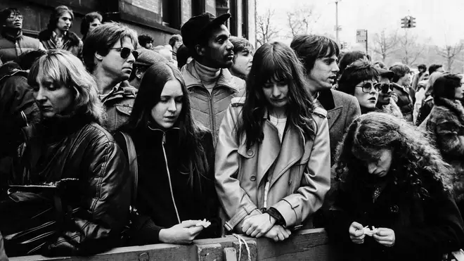 Crowds outside the Dakota react to the news of John Lennon's death on 9 December 1980