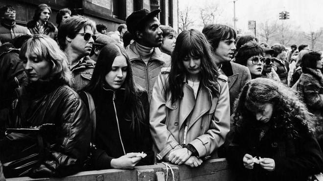 Crowds outside the Dakota react to the news of John Lennon's death on 9 December 1980