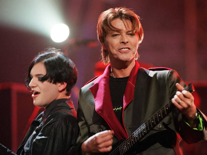 David Bowie and Brian Molko of Placebo performing at the Brit Awards, in the London Arena, 1999