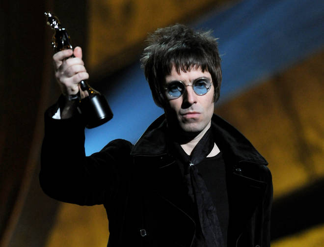 Liam Gallagher accepts Oasis' award for 'Best Album of 30 Years' on stage at The Brit Awards 2010