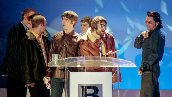Oasis win British Video presented by Michael Hutchence during The BRIT Awards 1996