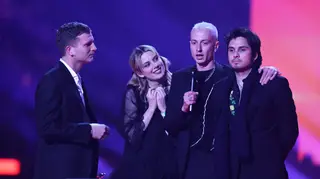Joff Oddie, Ellie Rowsell, Theo Ellis and Dean Ralph of Wolf Alice accept the Best Group award at The BRIT Awards 2022
