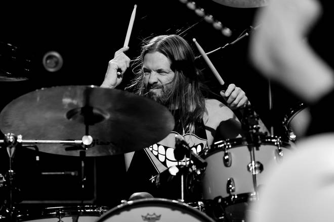 Taylor Hawkins plays with Foo Fighters at the after party for the premiere of Studio 666 in February 2022