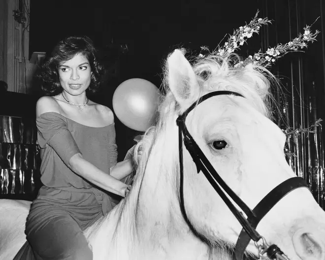 Bianca Jagger rides in on a white horse at during her birthday celebrations at Studio 54 in New York, May 1977.