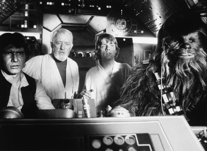 In the cockpit for Star Wars Episode IV: A New Hope - Harrison Ford as Han Solo, Alec Guiness as Obi-Wan Kenobi, Mark Hamill as Luke Skywalker and Peter Mayhew as Chewbacca.