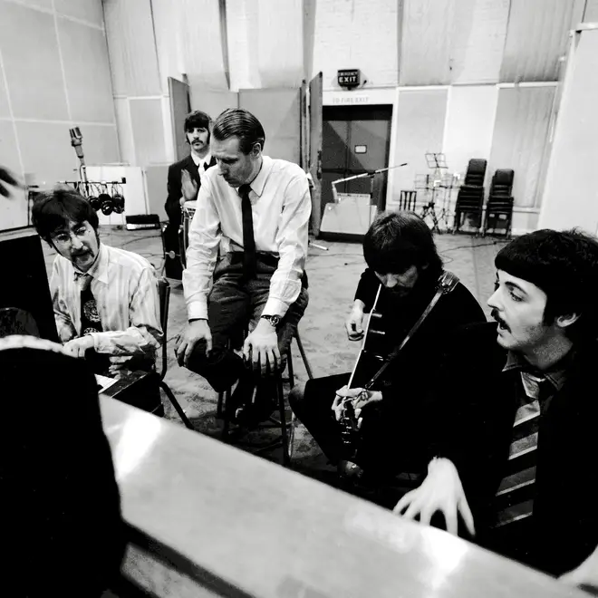 George Martin listens to The Beatles' latest slice of genius at Abbey Road studios, as the band record Sgt Pepper in 1967