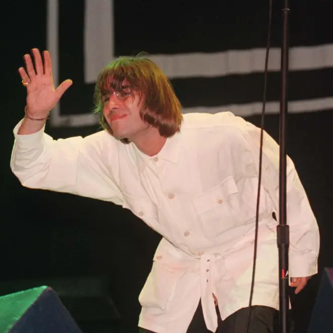 Liam Gallagher waves to the crowd at the Oasis shows in Knebworth, 1996