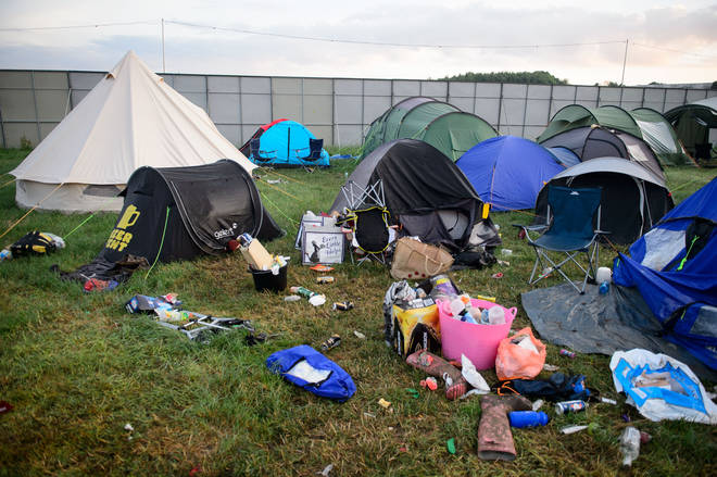 Tents, equipment and debris litter the camping fields on the morning after the Glastonbury Festival, 2014