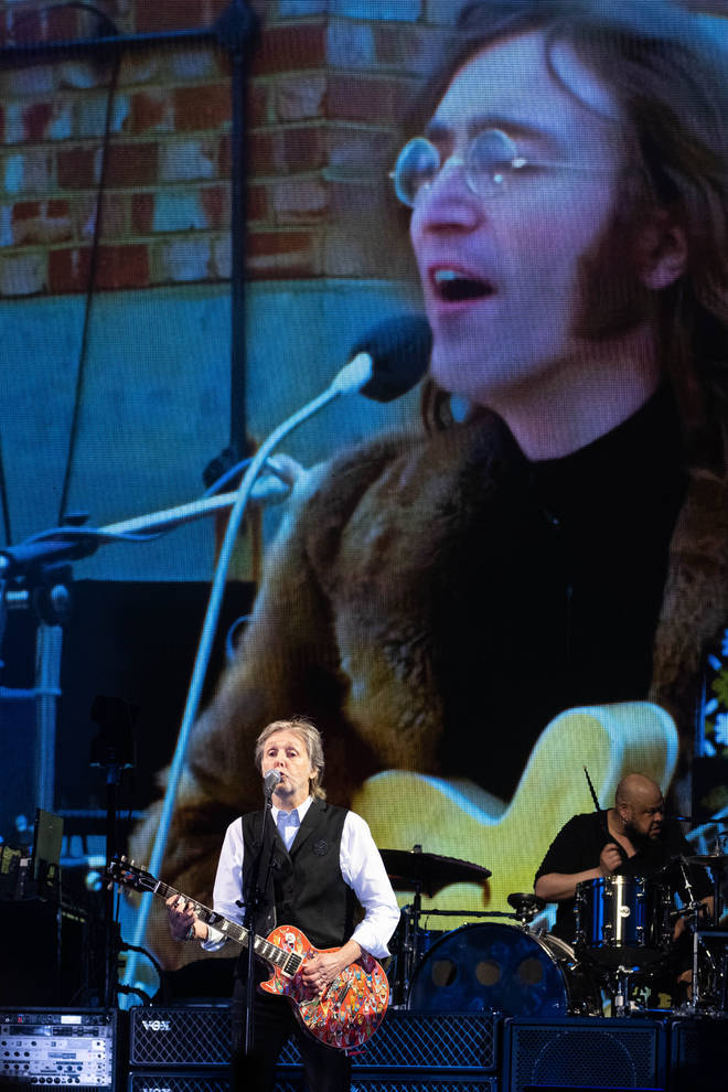 Paul McCartney performing alongside a projection of John Lennon at Glastonbury 2022