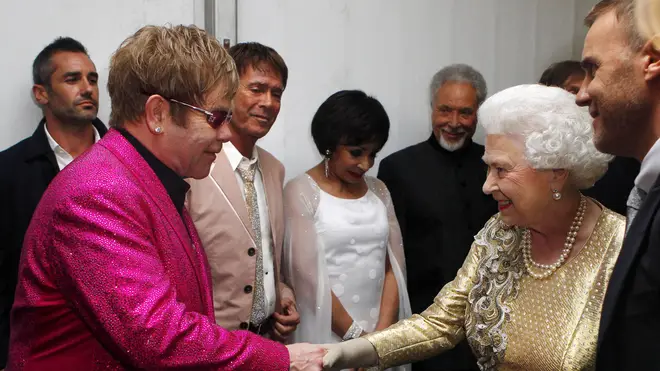 SIr Elton meets The Queen after the Diamond Jubilee Concert at Buckingham Palace in 2012