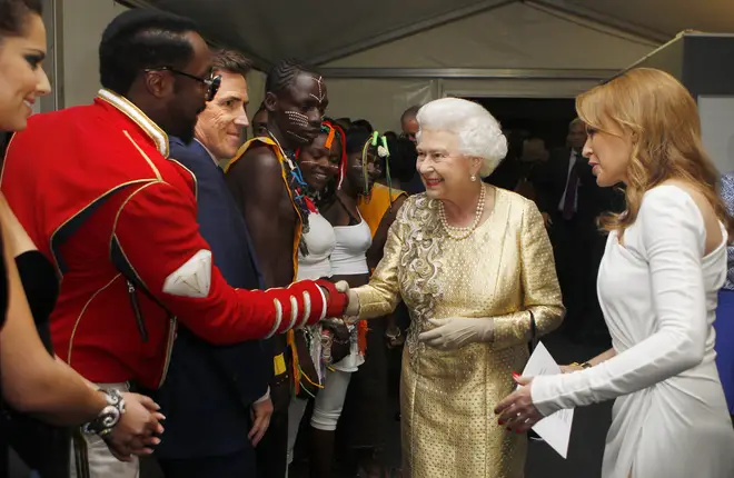 Kylie Minogue introduces Queen Elizabeth to will.i.am as Rob Brydon looks on, at the Diamond Jubilee concert in 2012.