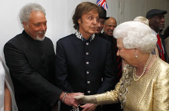 Queen Elizabeth II greets Sir Tom Jones and sir Paul McCartney at the Diamond Jubilee Concert in 2012