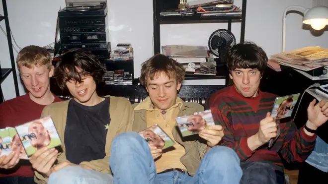 Blur in May 1991 with CD copies of their single There's No Other Way: Dave Rowntree, Alex James, Damon Albarn and Graham Coxon.