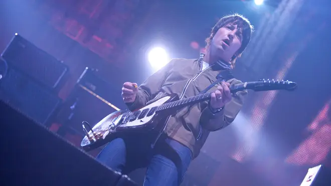 Gem Archer playing with Oasis in 2008