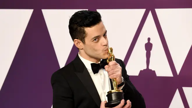 Rami Malek kisses his Best Actor Oscar Award for Queen Biopic Bohemian Rhapsody