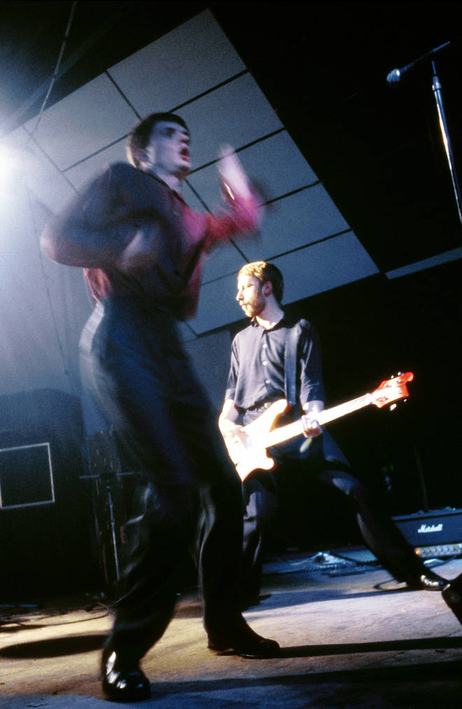 Ian Curtis and Peter Hook of Joy Division onstage in London, October 1980