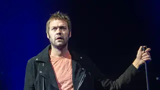 Kasabian's Tom Meighan on stage at Princes Street Gardens during Edinburgh Summer Sessions 2018