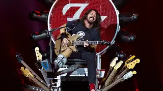 Dave Grohl plays with a broken leg in his specially made throne at Ziggodome, Amsterdam