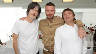 The Stone Roses John Squire and Mani pose with David Beckham at the Kent & Curwen show during London Men's Fashion Week in June 2018
