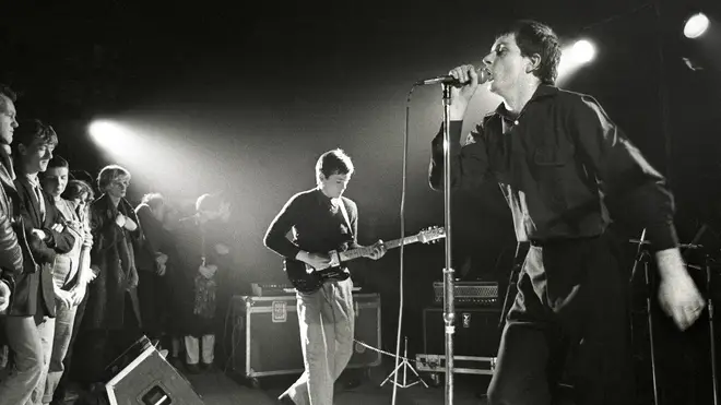 Ian Curtis performing live with Joy Division in the Netherlands in January 1980.