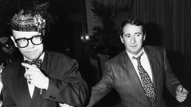 Elton John and manager John Reid at a party in 1988