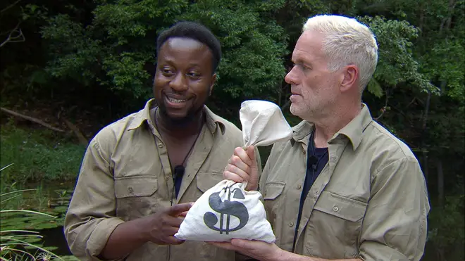 Babatúndé Aléshé and Chris Moyles take on the Dingo Dollars challenge in tonight's episode of I'm A Celebrity
