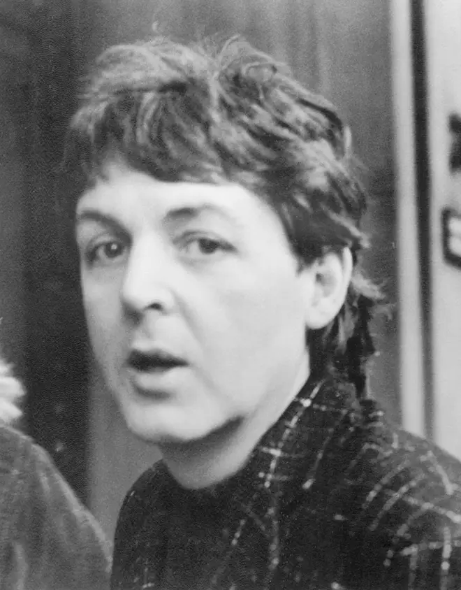 A visibly distraught Paul McCartney is papped as he leaves a recording studio on London's Oxford Street after learning of John Lennon's death