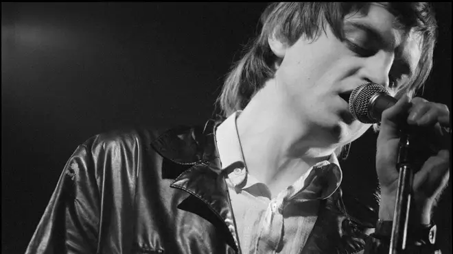Mark E Smith of The Fall performing at The Lyceum Theatre, London, UK on 12 December 1982