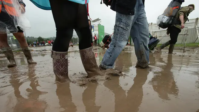 Revellers in the mud at Glastonbury Festival 2016