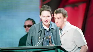 Mick Cooke and Richard Colburn of the band Belle & Sebastian, winners of Best Britist Newcomer Award, during the Brit Award 1999.