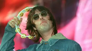 Liam Gallagher plays with Oasis at Wembley in 2000