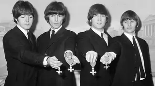 26th October 1965: The Beatles show off their MBEs at the Saville Theatre, London