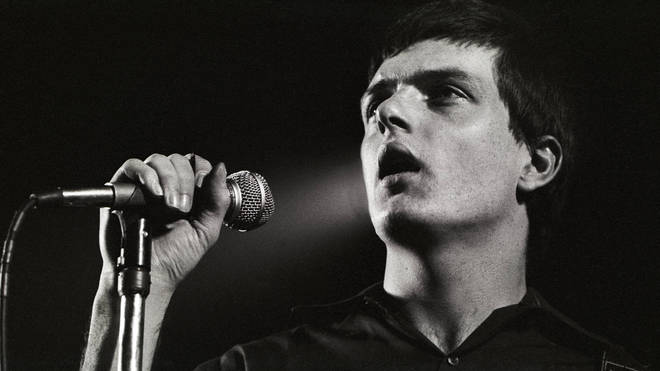 Ian Curtis performing live onstage with Joy Division in the Netherlands in January 1980