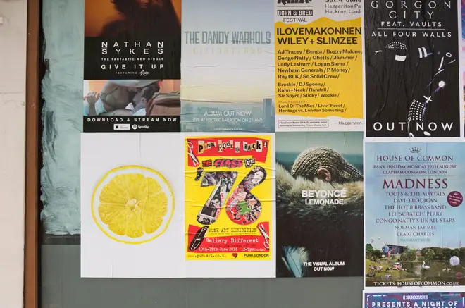 Fly-posted adverts, including the Stone Roses mysterious, unbranded lemon slice poster to announce their new single.