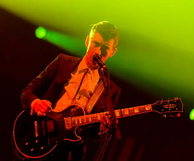 Alex Turner of Arctic Monkeys performs onstage during The 24th Annual KROQ Almost Acoustic Christmas at The Shrine Auditorium on December 7, 2013 in Los Angeles, California.
