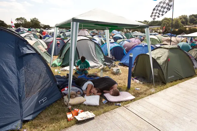 People sleeping outside their tents because of the heat at the Glastonbury