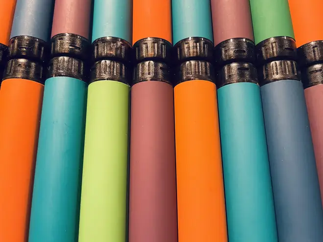 Close up shot of throwaway disposable flavoured vapes.