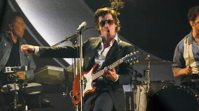 Alex Turner performing with Arctic Monkeys on Glastonbury's Pyramid Stage