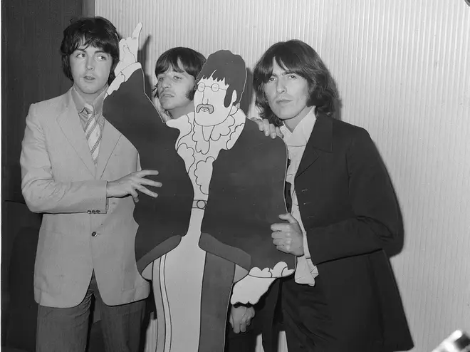 Paul, Ringo and George meet a cartoon John Lennon, July 1968