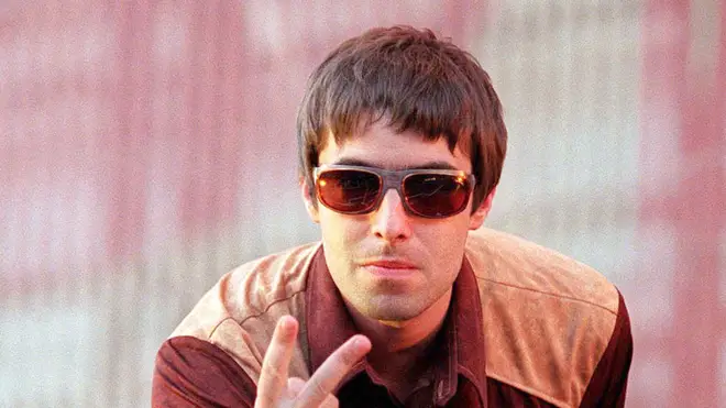 Liam Gallagher performs with Oasis in 1997