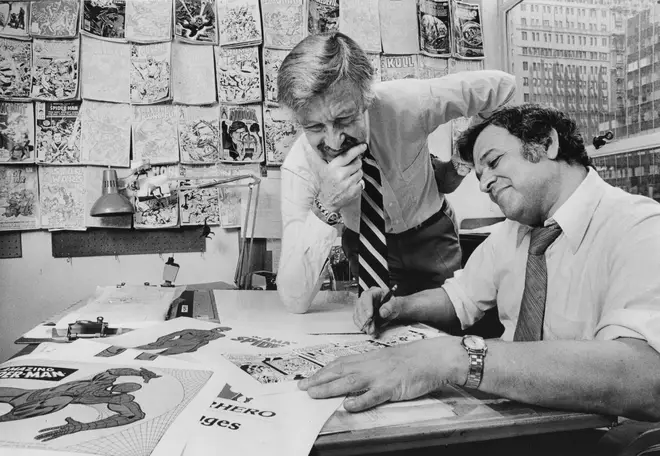 Comic book creator Stan Lee and artist John Romita go over a daily strip featuring Spiderman at their office on Madison Avenue in Manhattan, New York on May 23, 1978.