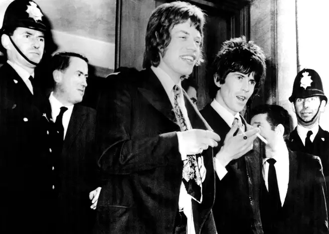 Mick Jagger and Keith Richards leave court after being charged with drug possession, 1967