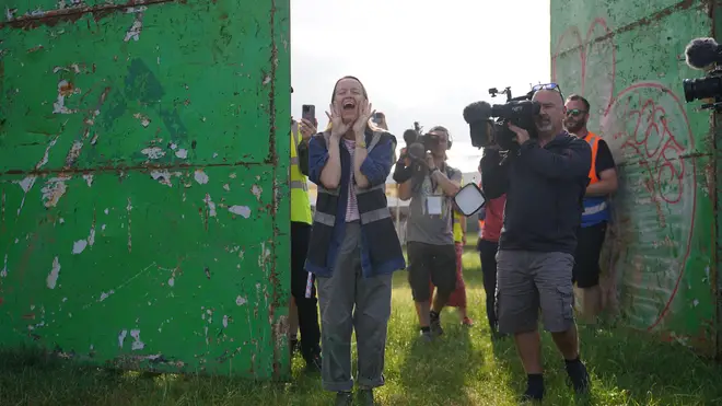 Emily Eavis opens the gates on the first day of Glastonbury Festival.