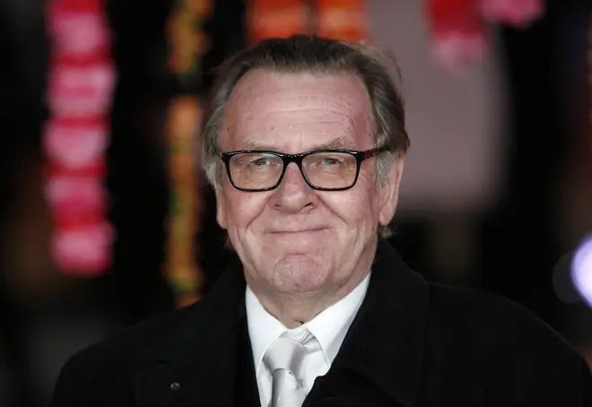 Tom Wilkinson poses for photographers on the red carpet ahead of the Royal and World Premiere of the film 'The Second Best Exotic Marigold Hotel' in central London on February 17, 2015.