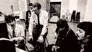George Martin listens to the latest idea from The Beatles during the Sgt Pepper sessions in January 1967.