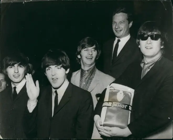 Brian Epstein with his most famous charges, The Beatles.
