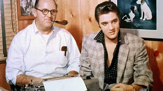 Elvis Presley with his manager,Colonel Tom Parker, signing a record contract with RCA Victor, October 1955.