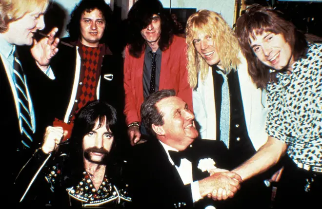 Spinal Tap are all smiles here with Polymer Records boss Sir Dennis Eton-Hogg, but that was before the label refused to release their album Smell The Glove.
